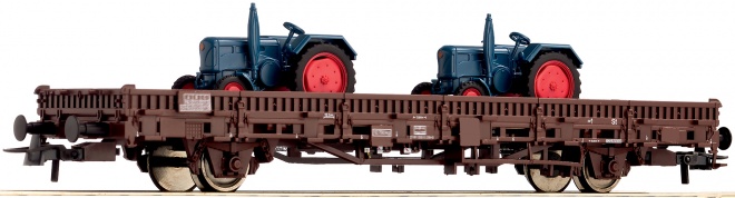Flat car loaded with tractors<br /><a href='images/pictures/Roco/67027.jpg' target='_blank'>Full size image</a>